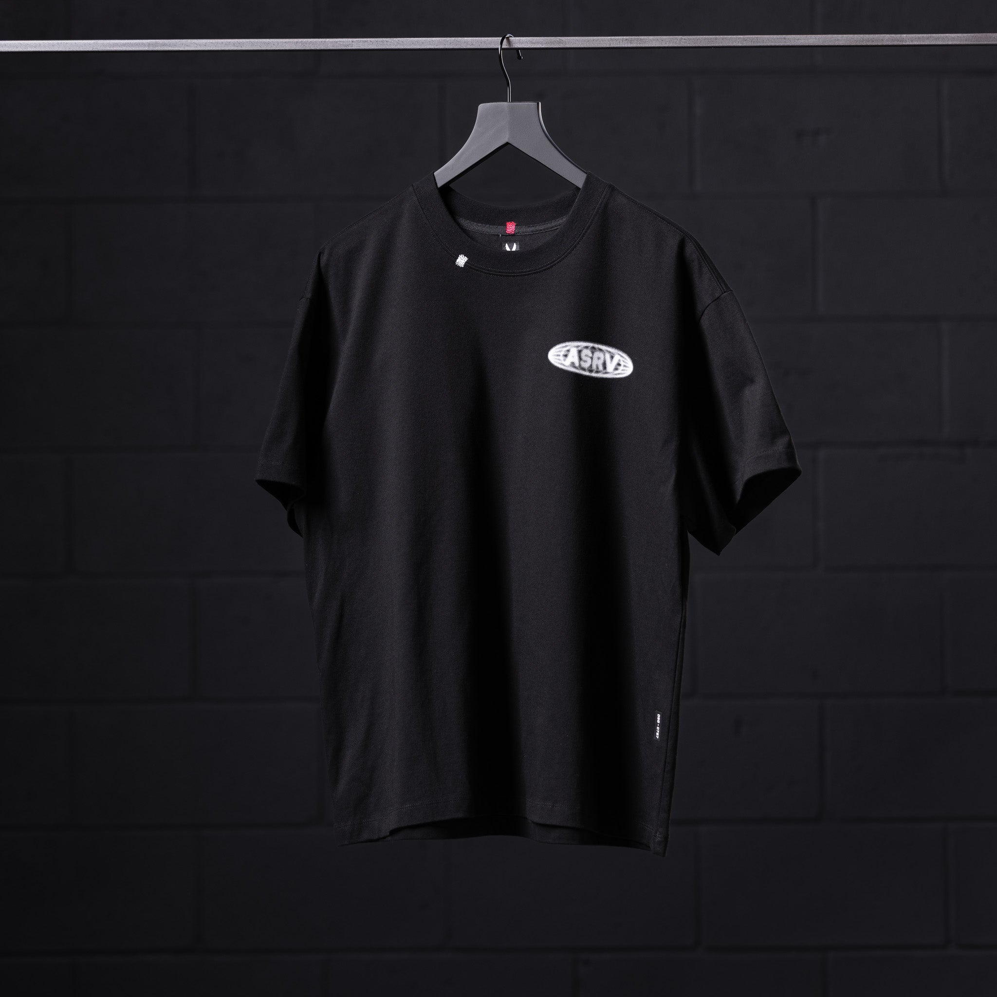 0797. Tech Essential™ Relaxed Tee - Black "Global Reach"