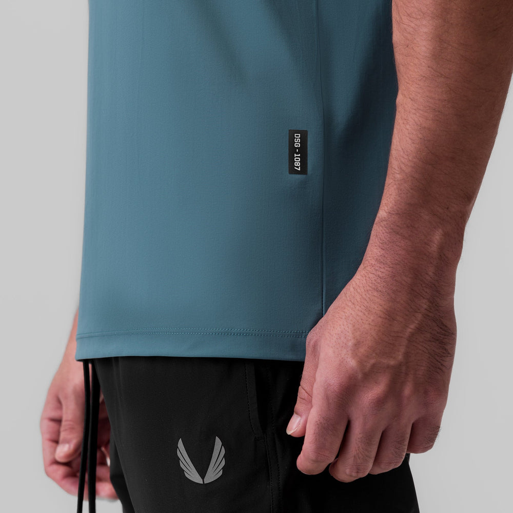 1087. Tetra-Lite® Ice Zip Tee - Storm