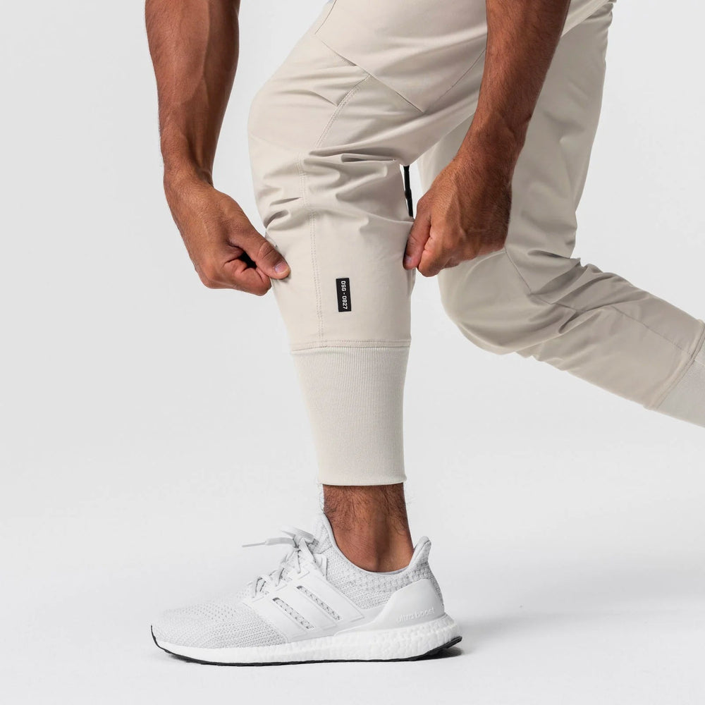 0827. Tetra-Lite® Inlay Pocket High Rib Jogger - Sand Smoke